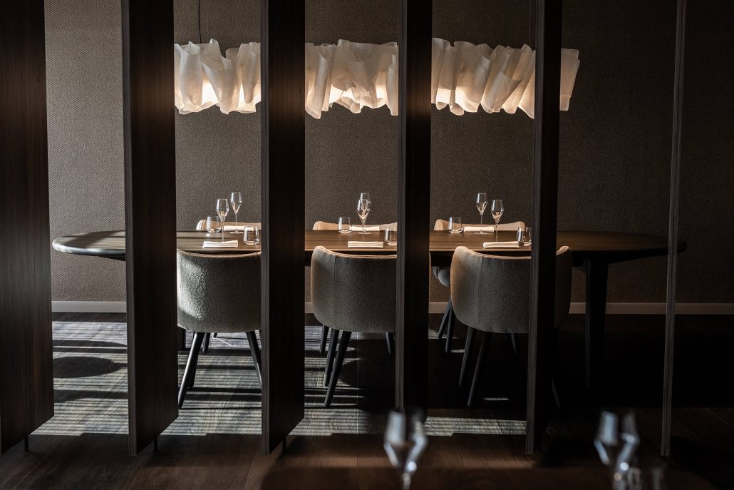 Chef preparing a course at MERTIA, a Stellenbosch dining destination with a seasonal tasting menu
